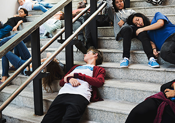 young-students-sleeping-on-the-staircase featured image